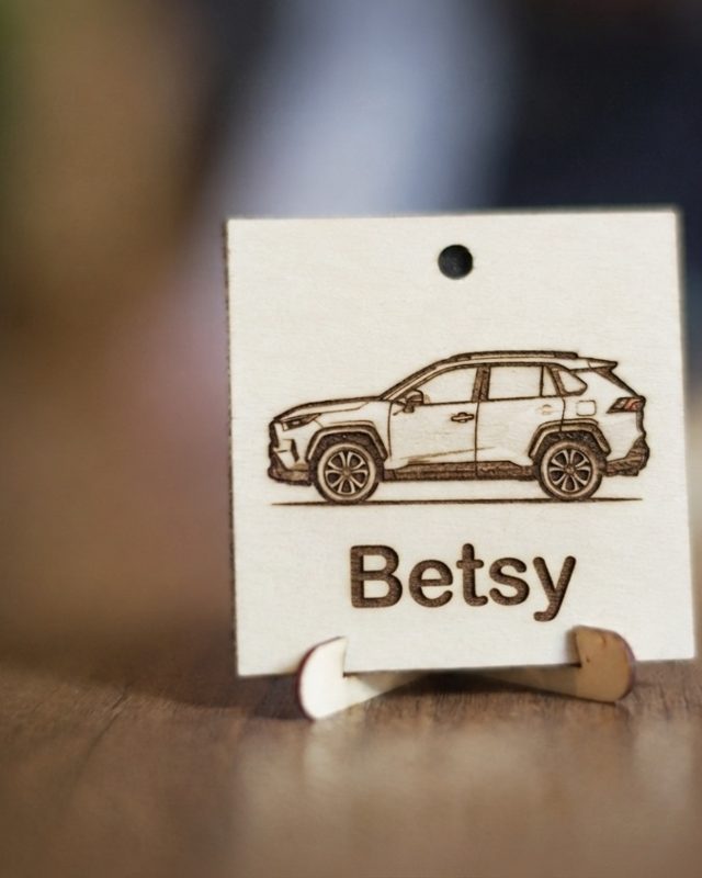 Engraved wood plaque with a SUV outline and the name Betsy