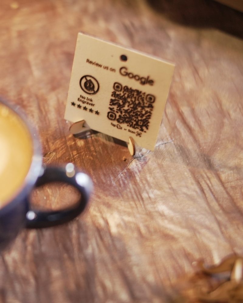 No Ink Engraver plaque next to a latte